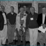 House Company meeting in Oxford Trustees: Martin Haskell ’68, Eric Eickhoff ’00, Ben Graham ’52, Tom Tatham ’56,  R.S. Neff ’53 (Please note the portrait in the background of Willis O. Robb, OWU  1879, who held the following Gen. Frat. positions: 1903-06 Gen. Frat. Pres.; 1887- 1903 Gen. Frat. VP; and 1872-1891 Mag. Editor.)